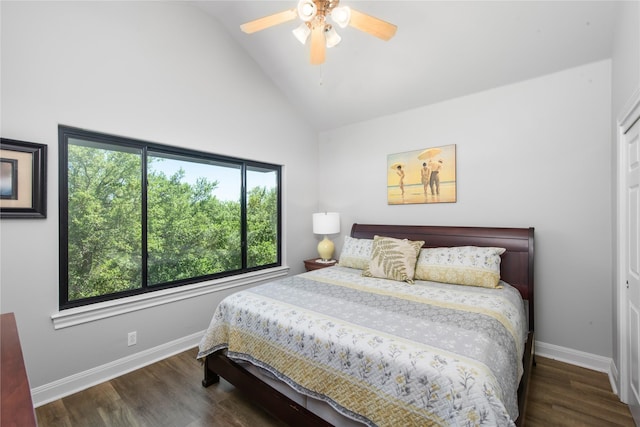 bedroom featuring ceiling fan, dark hardwood / wood-style flooring, and high vaulted ceiling