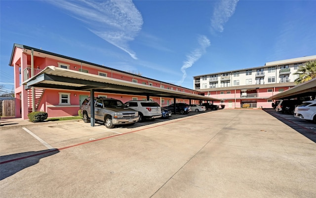 view of vehicle parking with a carport