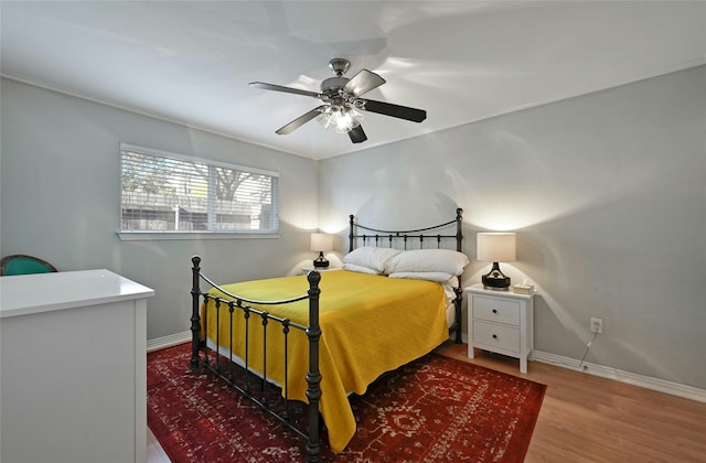 bedroom featuring ceiling fan and hardwood / wood-style flooring