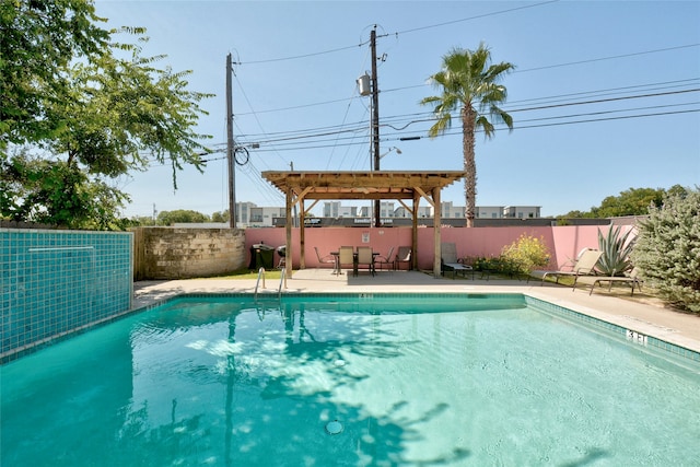 view of swimming pool with a pergola