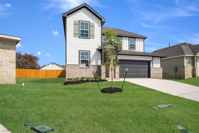 view of front property featuring a front yard and a garage