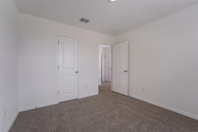 unfurnished bedroom with carpet flooring