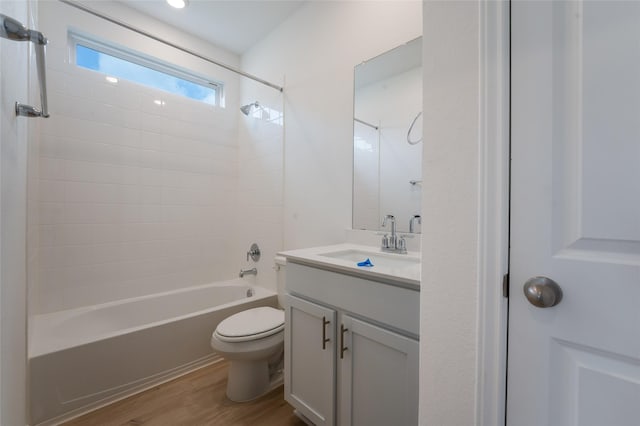 full bathroom featuring vanity, shower / washtub combination, toilet, and hardwood / wood-style flooring