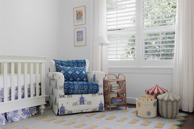 bedroom featuring a nursery area