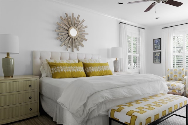 bedroom featuring ornamental molding and a ceiling fan