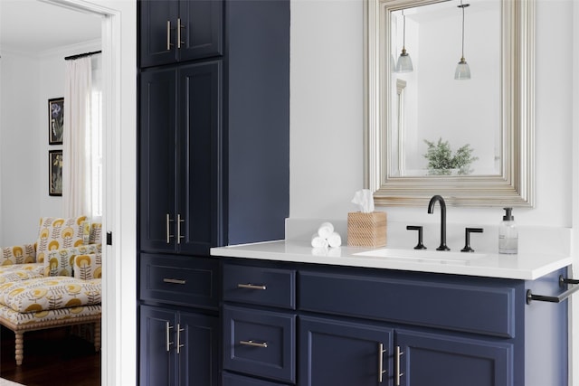 ensuite bathroom with ornamental molding, vanity, and ensuite bathroom