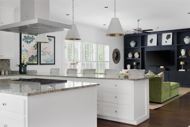 kitchen with white cabinetry, ventilation hood, dark wood-style flooring, and a center island