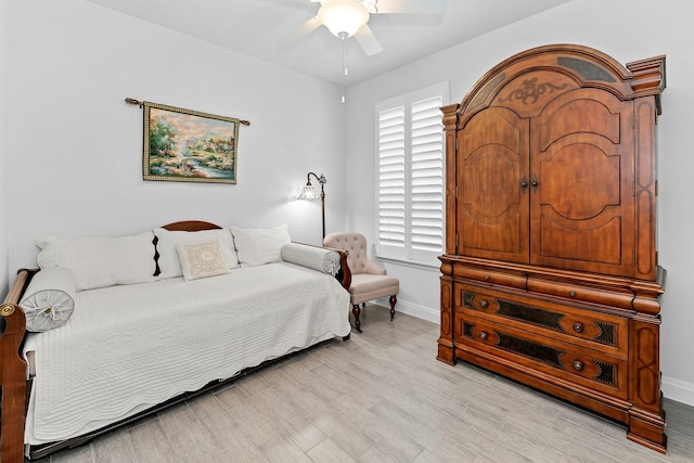 bedroom featuring ceiling fan and light hardwood / wood-style floors