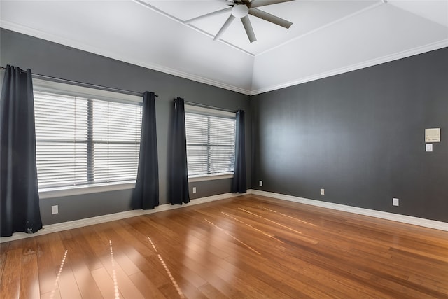 unfurnished room with ceiling fan, vaulted ceiling, crown molding, and hardwood / wood-style floors