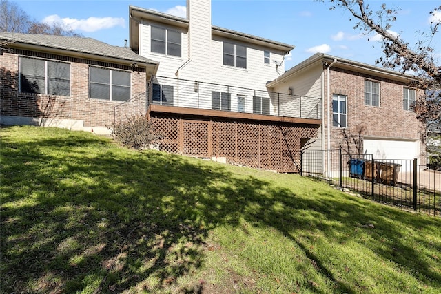 rear view of property with a yard, brick siding, fence, and a chimney