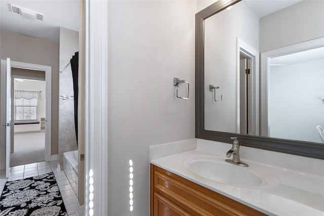 full bathroom with vanity, tile patterned flooring, and visible vents