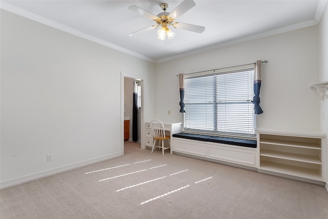 interior space with ceiling fan and crown molding