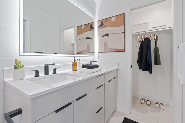 bathroom with tile patterned flooring and vanity