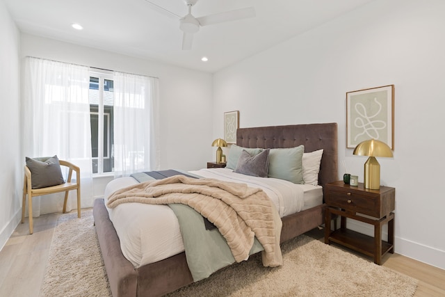 bedroom featuring ceiling fan and light hardwood / wood-style flooring