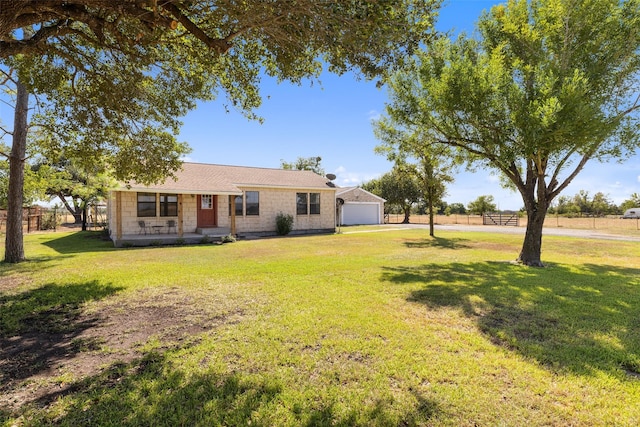 view of front of home with a front lawn and a garage