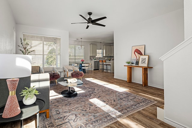 living room featuring ceiling fan and hardwood / wood-style flooring