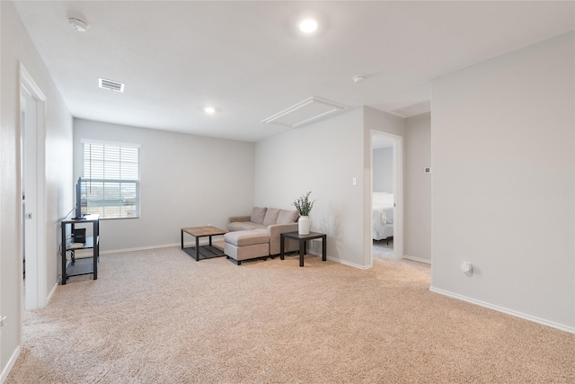 living area with light carpet