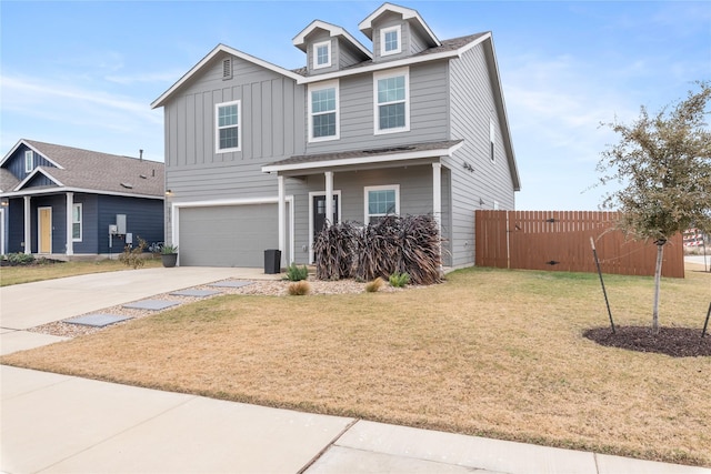 view of front facade with a front yard and a garage