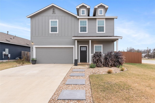 view of front facade featuring a front yard and a garage