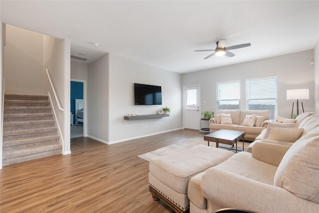 living room with ceiling fan and wood-type flooring