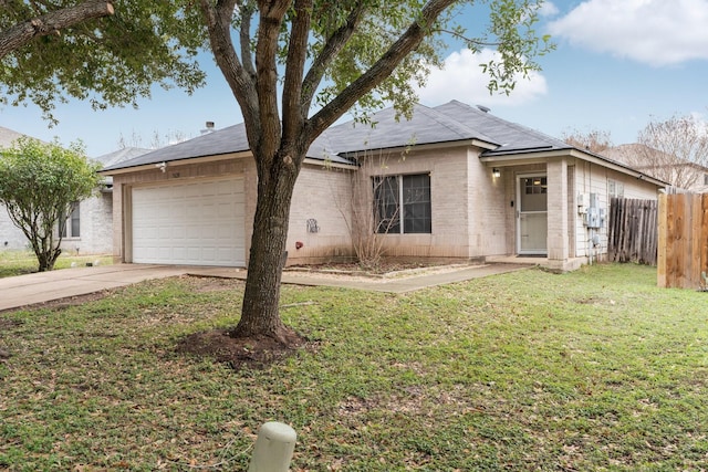 single story home with a front yard and a garage