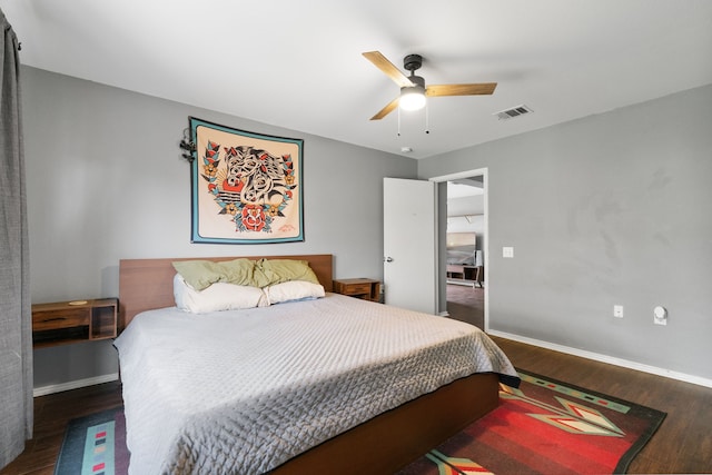 bedroom featuring dark hardwood / wood-style flooring and ceiling fan