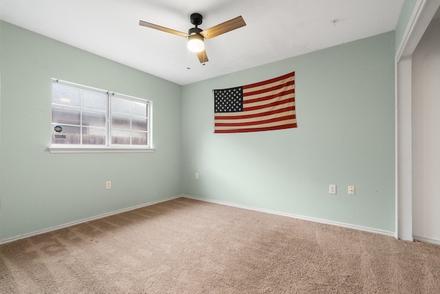 carpeted empty room with ceiling fan