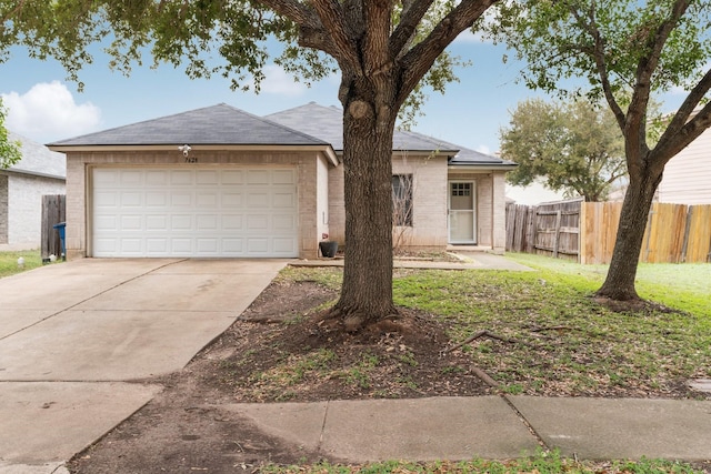 ranch-style house featuring a garage