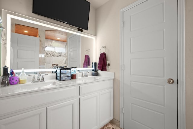 bathroom featuring a shower and vanity