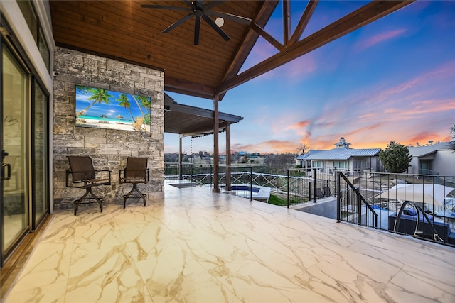 view of patio featuring a balcony and ceiling fan