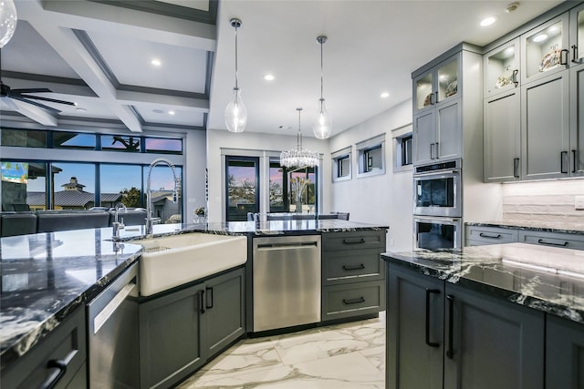 kitchen featuring coffered ceiling, stainless steel appliances, decorative backsplash, sink, and decorative light fixtures