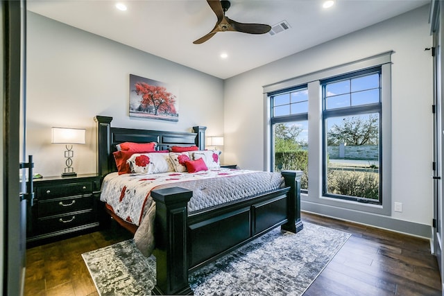 bedroom featuring ceiling fan and dark wood-type flooring