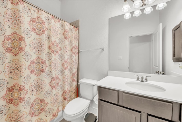 bathroom with toilet and vanity