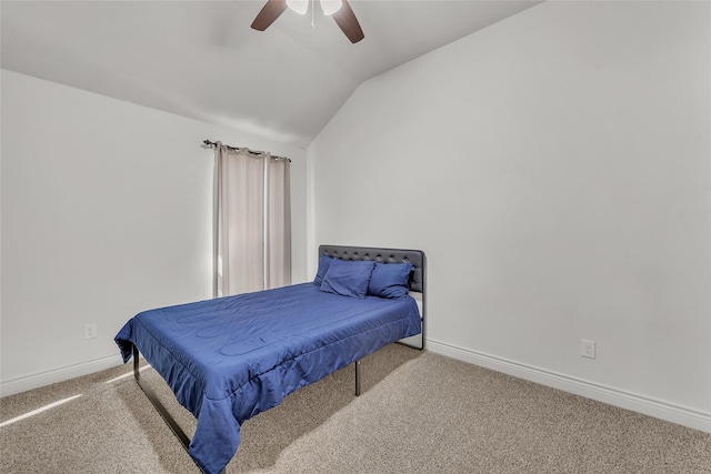 bedroom with ceiling fan, vaulted ceiling, and light colored carpet