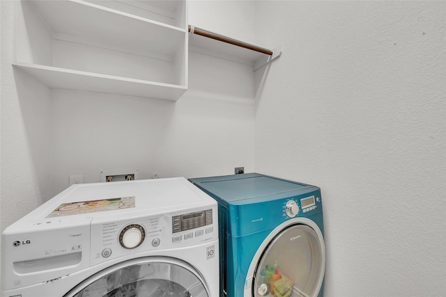 laundry area with washing machine and dryer