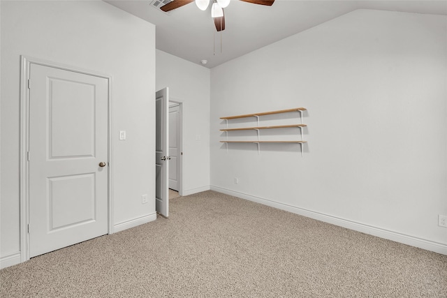 unfurnished bedroom featuring ceiling fan, lofted ceiling, and carpet flooring