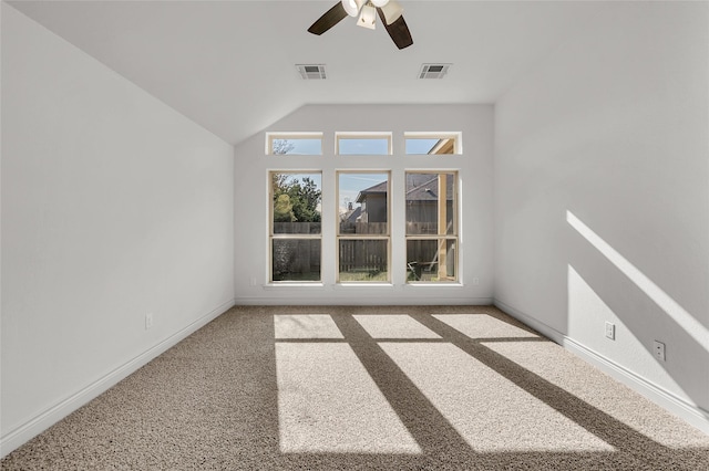 spare room featuring ceiling fan and carpet floors