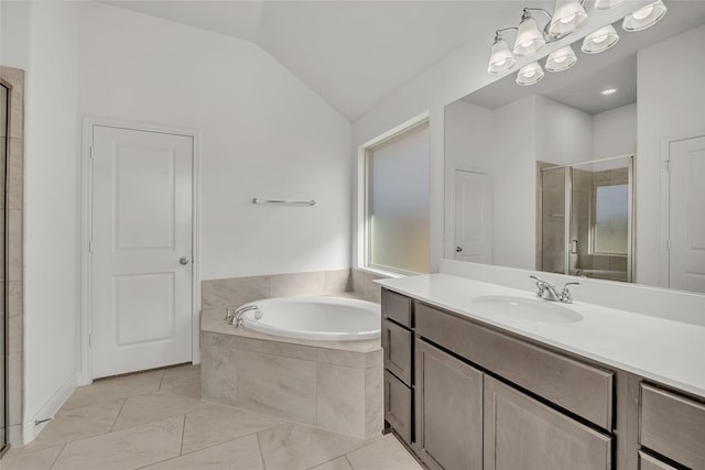 bathroom featuring lofted ceiling, tile patterned flooring, independent shower and bath, and vanity