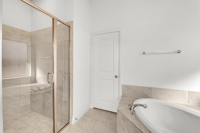 bathroom featuring separate shower and tub and tile patterned floors