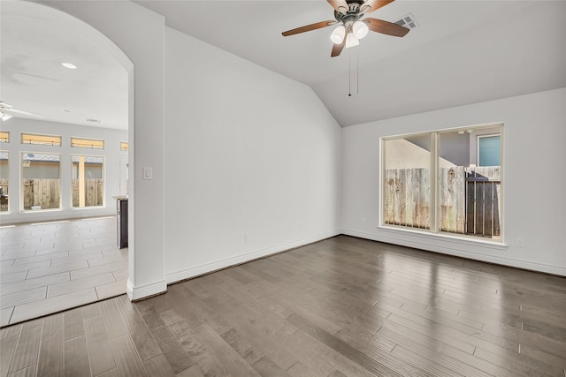 unfurnished living room featuring ceiling fan, hardwood / wood-style floors, and vaulted ceiling