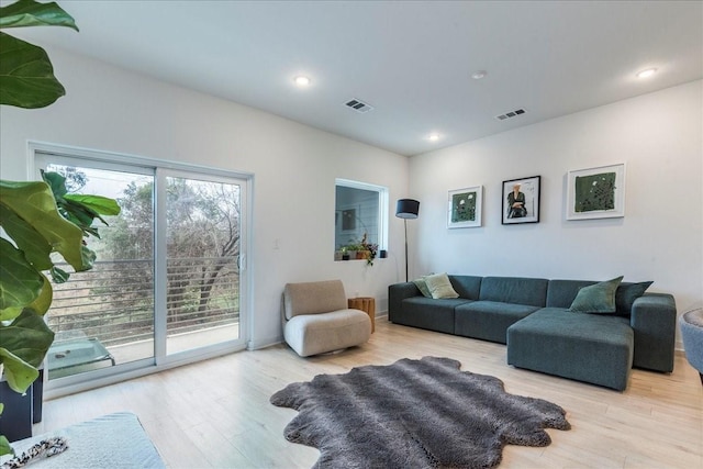 living room with light hardwood / wood-style floors