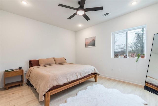 bedroom featuring light wood-type flooring and ceiling fan