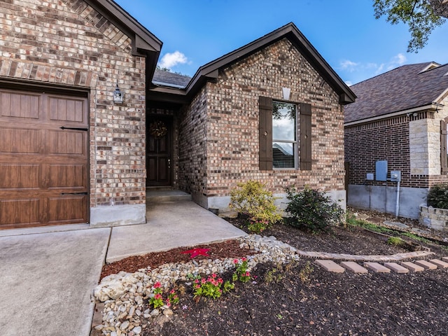 entrance to property featuring a garage