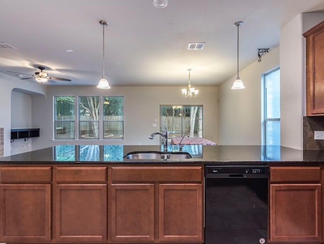 737 Foxtail Run, San Marcos, TX 78666 - kitchen with dishwasher, plenty of natural light, decorative light fixtures, and dark stone counters