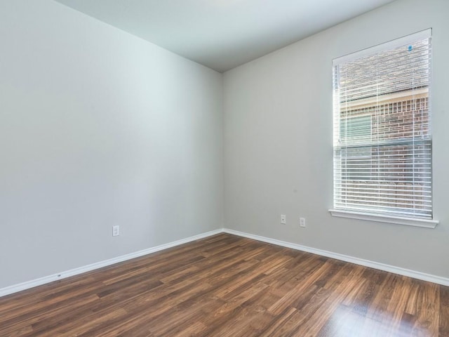 737 Foxtail Run, San Marcos, TX 78666 - spare room featuring dark wood-type flooring and baseboards