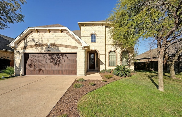 view of front facade with a front yard and a garage