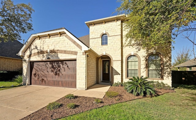 view of front facade with a front yard and a garage