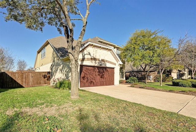 view of front facade featuring a front yard and a garage