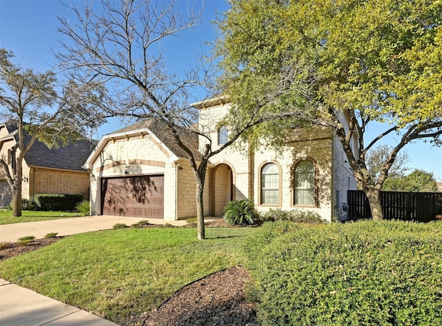 view of front of home featuring a front yard and a garage