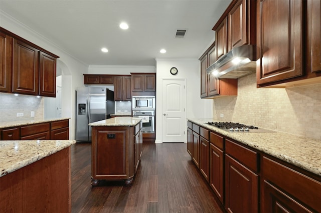 kitchen featuring light stone counters, tasteful backsplash, crown molding, and appliances with stainless steel finishes